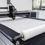 CO2 textile laser cutting machine cutting polyester fabric roll with clean sealed edge